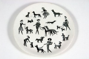 There are dogs. They are on plates